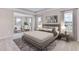 Relaxing main bedroom showcasing a sitting area, large windows, and a stylish decor for unwinding at 3310 Amber Waves Ct, Plant City, FL 33565