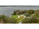 Stunning aerial view of the lakefront park with a pavilion and lush landscaping at 3675 Janus Way, Palm Harbor, FL 34685