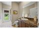 Bathroom featuring a toilet, vanity with dark cabinets, and a glass-enclosed shower at 3675 Janus Way, Palm Harbor, FL 34685