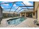 Screened-in pool with brick patio, perfect for outdoor relaxation and entertainment at 3675 Janus Way, Palm Harbor, FL 34685