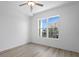 Bright bedroom showcasing a large window view and vinyl floors at 400 150Th Ave # 206, Madeira Beach, FL 33708