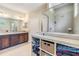 Bathroom featuring a glass-enclosed shower and a large dark-wood vanity at 450 Harbor Springs Dr, Palm Harbor, FL 34683