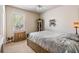 Bedroom with a large window, neutral carpet, and unique vintage decor at 450 Harbor Springs Dr, Palm Harbor, FL 34683