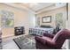 Bedroom with neutral walls, tray ceilings, and a unique compass-themed rug at 450 Harbor Springs Dr, Palm Harbor, FL 34683