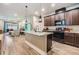 Stylish kitchen featuring an island with a granite countertop and modern appliances at 450 Harbor Springs Dr, Palm Harbor, FL 34683