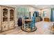 Comfortable living area with wood-look floors and lots of light from the windows at 450 Harbor Springs Dr, Palm Harbor, FL 34683