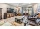 Inviting living room with sliding doors leading to the patio and lush backyard views at 450 Harbor Springs Dr, Palm Harbor, FL 34683