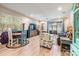 Spacious living room with wood-look flooring and sliding glass doors to the backyard at 450 Harbor Springs Dr, Palm Harbor, FL 34683