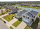 Aerial view of home with a two-car garage in a well-maintained community near a pond at 4727 Lindever Ln, Palmetto, FL 34221