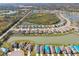 Panoramic aerial shot of a neighborhood with a beautiful lake and well-manicured lawns at 4727 Lindever Ln, Palmetto, FL 34221