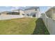 Large backyard is enclosed with white vinyl fencing offering an outdoor living space at 4727 Lindever Ln, Palmetto, FL 34221