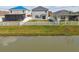 Tranquil backyard with a white fence, overlooking a serene pond, perfect for relaxation at 4727 Lindever Ln, Palmetto, FL 34221