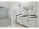Bathroom featuring a double vanity sink, white cabinets, and gray walls at 4727 Lindever Ln, Palmetto, FL 34221