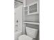 This bathroom has a tub/shower combo, a toilet, and built-in shelving at 4727 Lindever Ln, Palmetto, FL 34221