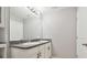 The bathroom features double sinks, gray counters, white cabinets, and a large mirror at 4727 Lindever Ln, Palmetto, FL 34221