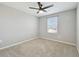 Bedroom with gray walls, ceiling fan, carpet, and a window at 4727 Lindever Ln, Palmetto, FL 34221