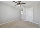 Bedroom featuring carpet floor, gray walls, ceiling fan, and white door at 4727 Lindever Ln, Palmetto, FL 34221