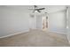 This bedroom has carpet, gray walls, recessed lighting, and a bathroom nearby at 4727 Lindever Ln, Palmetto, FL 34221