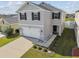 Two-story home featuring a two-car garage, tidy landscaping, and a welcoming entryway at 4727 Lindever Ln, Palmetto, FL 34221