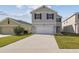 Two-story home with a wide driveway, black shutter accents, and well-manicured landscaping at 4727 Lindever Ln, Palmetto, FL 34221