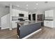 Bright kitchen featuring a large island, stainless steel appliances, and modern white cabinetry at 4727 Lindever Ln, Palmetto, FL 34221