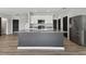 Bright and open kitchen, stainless steel appliances, featuring a kitchen island with granite countertops at 4727 Lindever Ln, Palmetto, FL 34221
