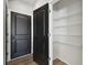 View of a walk in pantry with wire shelving and dark trim door at 4727 Lindever Ln, Palmetto, FL 34221