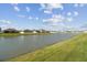 Scenic view of the pond and neighboring homes in this peaceful community at 4727 Lindever Ln, Palmetto, FL 34221