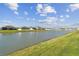 A tranquil view of the pond provides a serene backdrop to this community at 4727 Lindever Ln, Palmetto, FL 34221