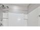 Shower with adjustable shower head and white tile walls at 4727 Lindever Ln, Palmetto, FL 34221