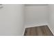 An empty walk-in closet with grey walls and light wood flooring at 4727 Lindever Ln, Palmetto, FL 34221