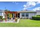 Well-maintained backyard featuring a pergola, lush green lawn, and a charming outdoor space at 6113 Plover Meadow St, Lithia, FL 33547