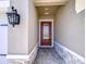 Inviting entryway showcasing a stylish front door with decorative glass and stone accents at 6113 Plover Meadow St, Lithia, FL 33547