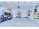 Spacious garage with epoxy floors and ample storage space for vehicles and tools at 6113 Plover Meadow St, Lithia, FL 33547