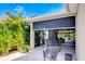 Screened lanai featuring comfortable seating and views of lush landscaping for outdoor relaxation at 6113 Plover Meadow St, Lithia, FL 33547