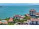 Stunning aerial view of waterfront condos with red tile roofs and turquoise water backdrop at 6268 Palma Del Mar S Blvd # 113, St Petersburg, FL 33715
