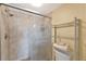 Modern bathroom featuring a tiled shower with glass doors and a towel rack for added convenience at 6268 Palma Del Mar S Blvd # 113, St Petersburg, FL 33715