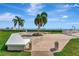 Charming brick courtyard featuring a tranquil garden, comfortable seating, and stunning waterfront views at 6268 Palma Del Mar S Blvd # 113, St Petersburg, FL 33715
