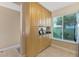 Bright kitchen with ample storage in wooden cabinets, granite counters, and a large window for natural light at 6268 Palma Del Mar S Blvd # 113, St Petersburg, FL 33715