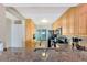 Bright kitchen featuring wooden cabinetry, granite countertops, stainless steel appliances, and a view of the outdoors at 6268 Palma Del Mar S Blvd # 113, St Petersburg, FL 33715