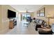 The living room features tile flooring, a ceiling fan, and a sliding glass door leading to a balcony at 6268 Palma Del Mar S Blvd # 113, St Petersburg, FL 33715