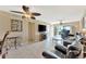Bright living room boasts tile floors, contemporary ceiling fan, and seamless access to a scenic balcony view at 6268 Palma Del Mar S Blvd # 113, St Petersburg, FL 33715