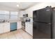 Efficient kitchen featuring white cabinetry, modern appliances, and ample counter space at 628 47Th W St, Palmetto, FL 34221