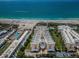 Aerial view of the resort with a beautiful beach and ocean views at 6500 Sunset Way # 501, St Pete Beach, FL 33706