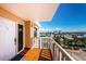 Enjoy city views from this condo balcony with tile floors and a white railing at 6500 Sunset Way # 501, St Pete Beach, FL 33706