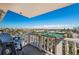 Relaxing balcony view with seating, white railings, and a beautiful view of the city at 6500 Sunset Way # 501, St Pete Beach, FL 33706
