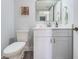 Well-lit bathroom featuring a stylish vanity, framed mirror, and neutral paint at 6500 Sunset Way # 501, St Pete Beach, FL 33706