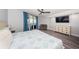 Comfortable bedroom with stylish furnishings, a view from balcony, and an entertainment center at 6500 Sunset Way # 501, St Pete Beach, FL 33706