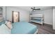 Bright bedroom with a comfortable king size bed, bunk beds, ceiling fan, and stylish decor at 6500 Sunset Way # 501, St Pete Beach, FL 33706