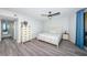 Inviting bedroom with bright walls, stylish furnishings, and a view from the balcony at 6500 Sunset Way # 501, St Pete Beach, FL 33706